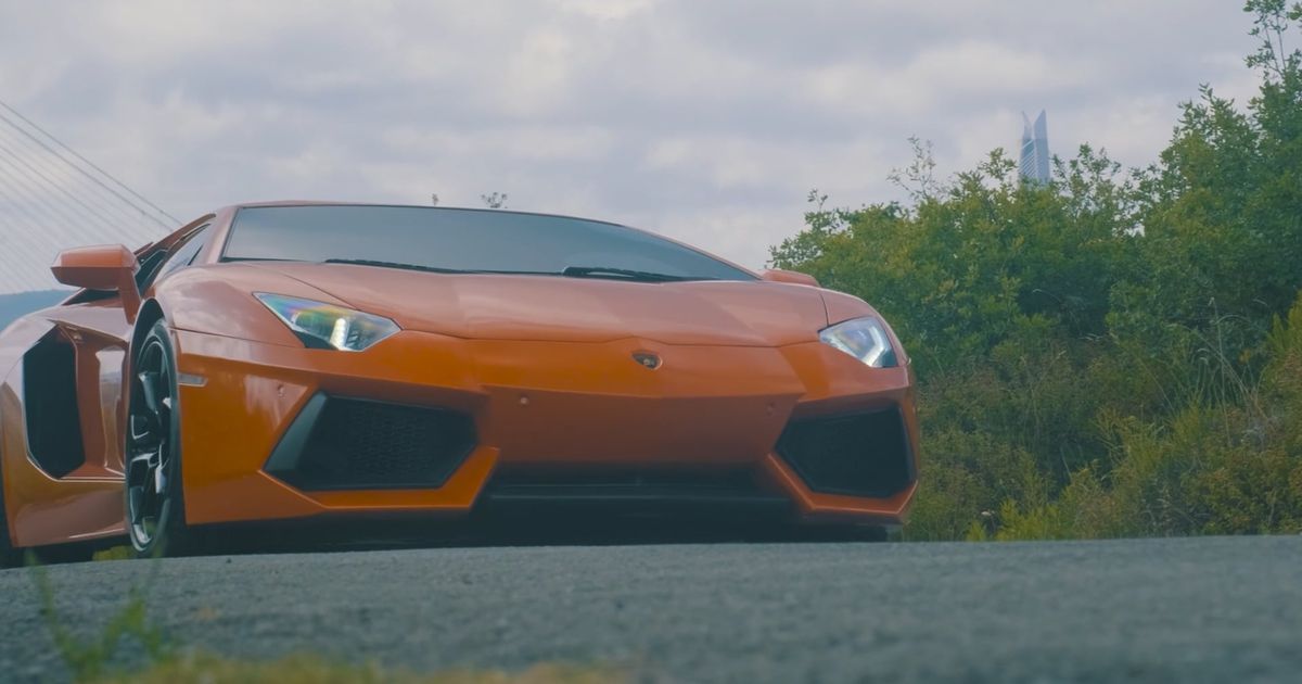 Luxury sports car driving on open road