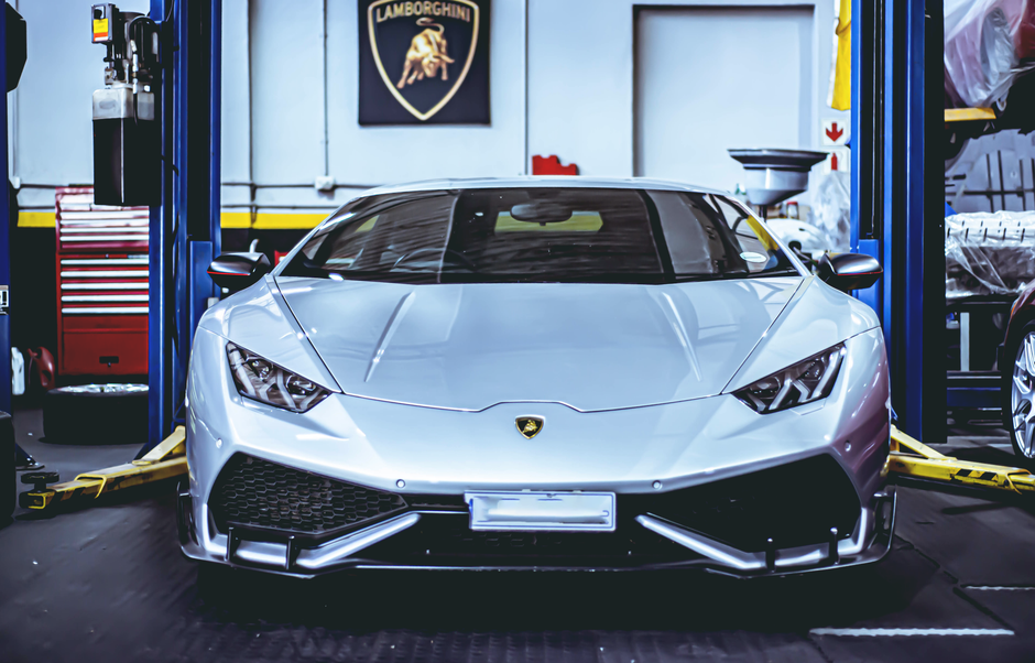 Mechanic working on exotic car engine