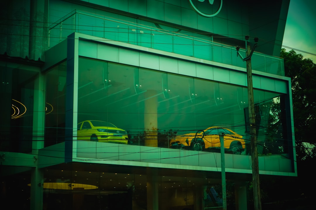 Modern luxury car showroom displaying premium vehicles with professional presentation